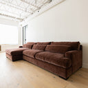 Large sectional in a burgundy velvet upholstery.