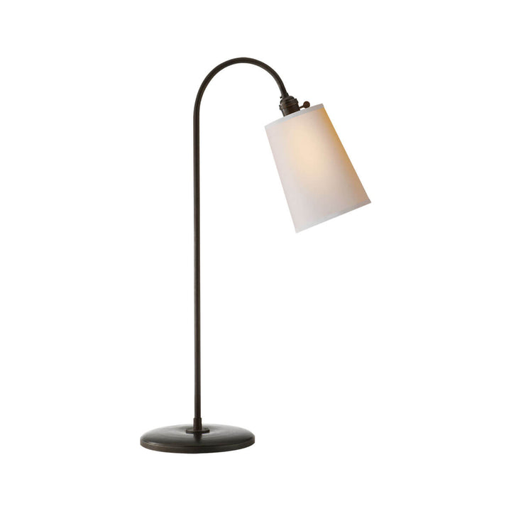 The Mia Table Lamp has an aged iron stem with a curved top and a natural paper shade.