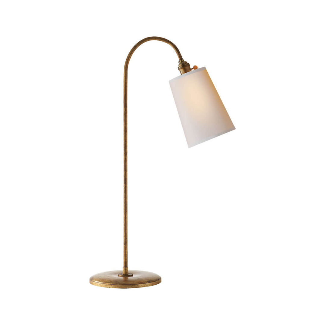 The Mia Table Lamp has a gilded iron stem with a curved top and a natural paper shade.