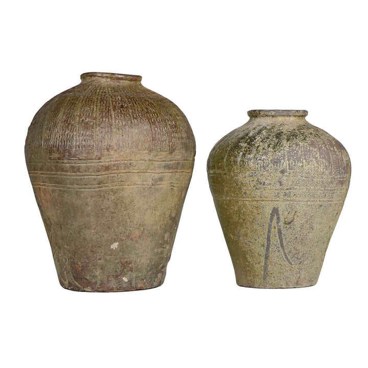 The Suopo Jar is a unique vintage clay jar with aging and marking details.