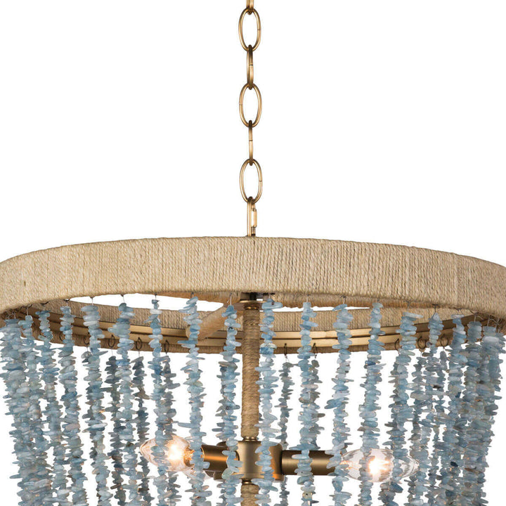 Closeup of the rattan-wrapped metal frame and strings of aqua beads on the sea inspired chandelier.