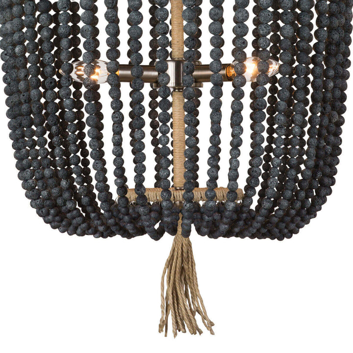 Closeup of the blue black round bead strings and fringe detail on the coastal inspired, beaded chandelier.