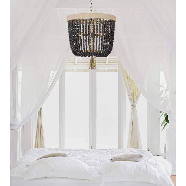 Beaded chandelier in a modern farmhouse bedroom.