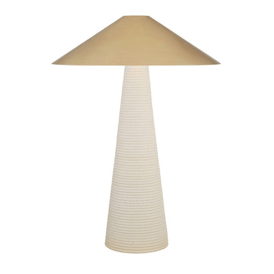 Transitional table lamp with antique brass shade and porous ceramic base.