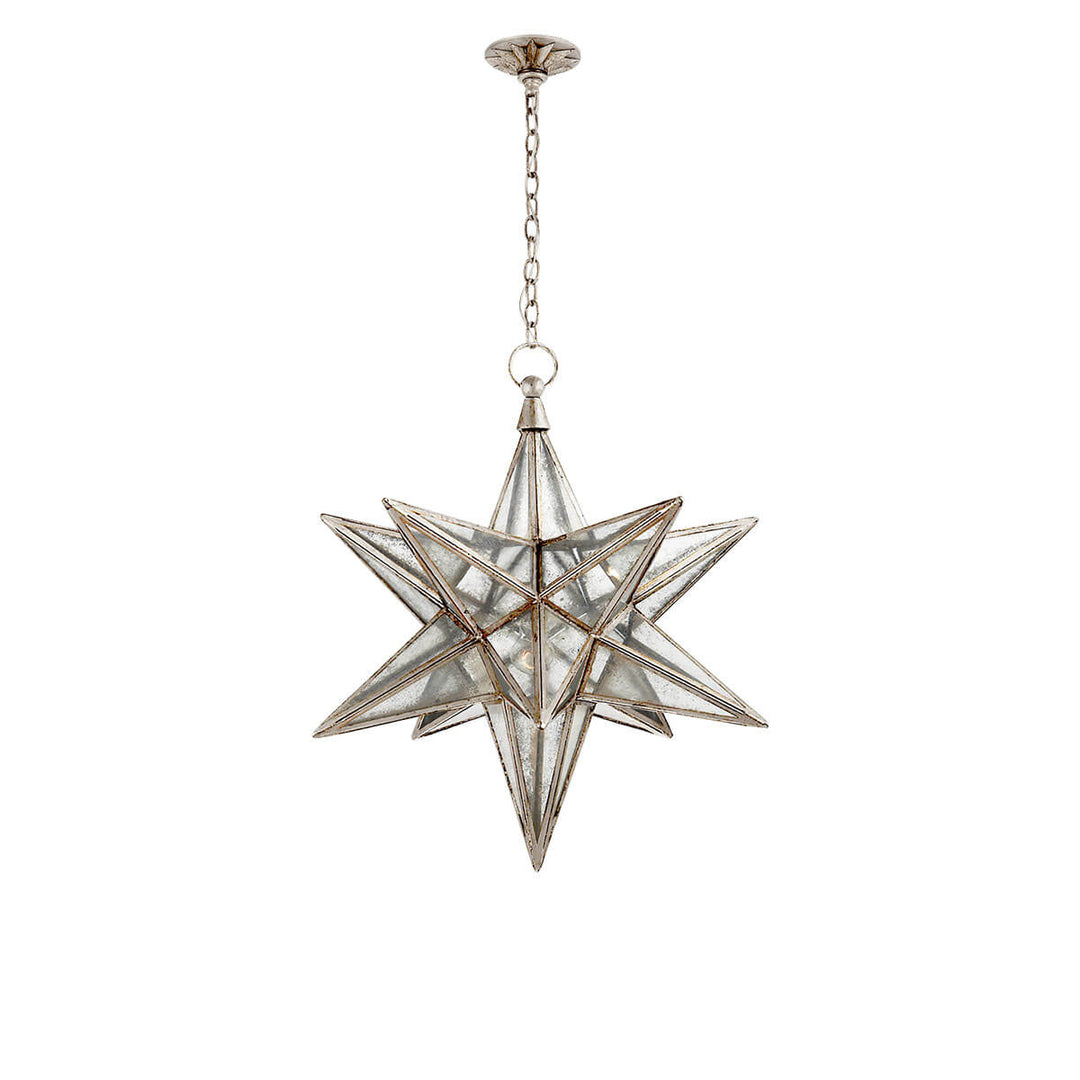 The Moravian Star Lantern is a star-shaped pendant light with burnished silver leaf joints, antique mirrored panels, and a delicate hanging chain.