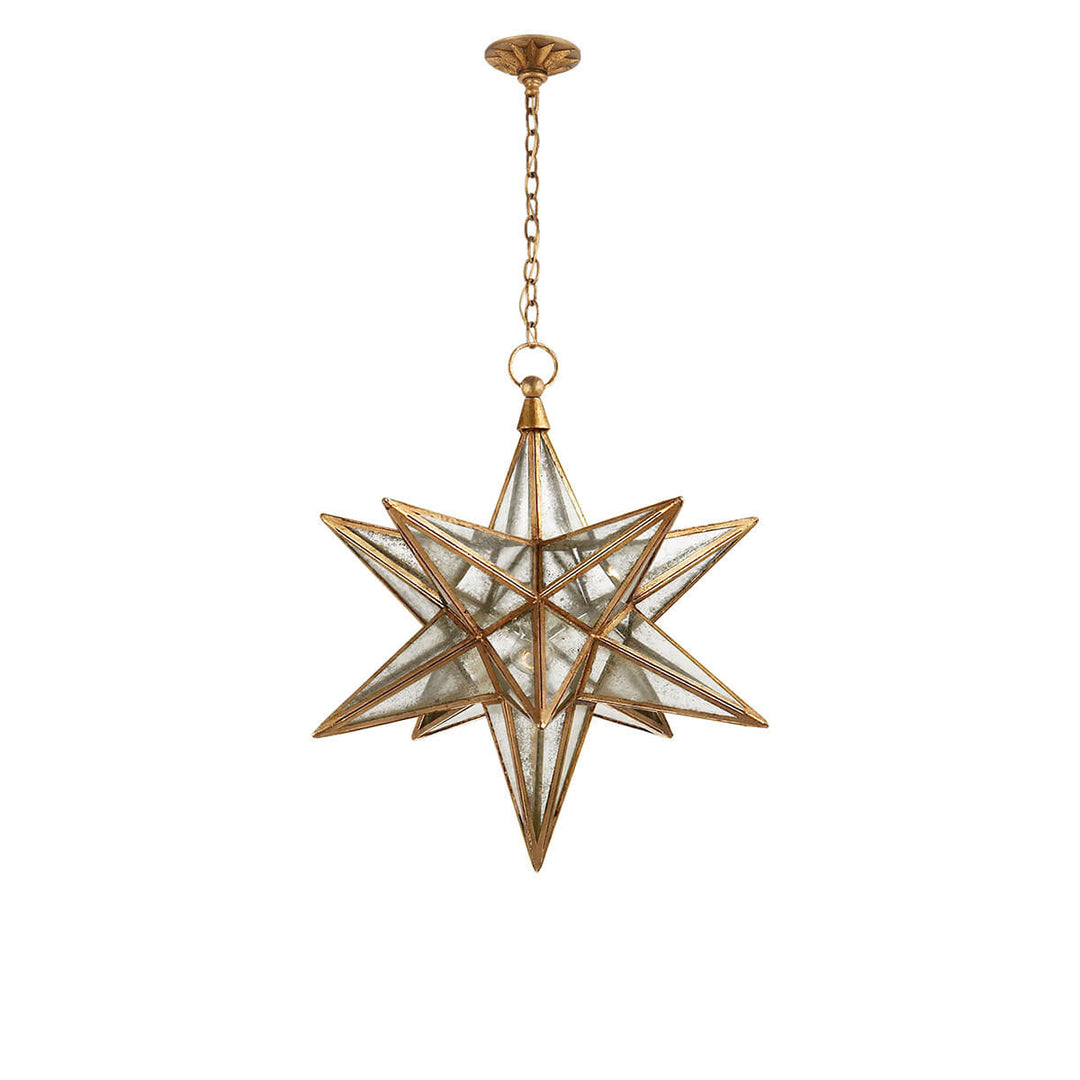 The Moravian Star Lantern is a star-shaped pendant light with gilded iron joints, antique mirrored panels, and a delicate hanging chain.