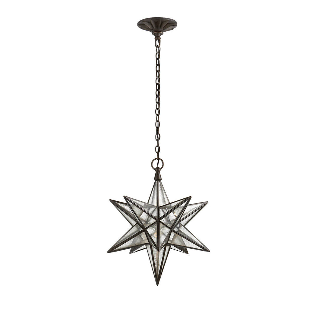 The medium sized Moravian Star Lantern is a star-shaped pendant light with aged iron joints, antique mirrored panels, and a delicate hanging chain.