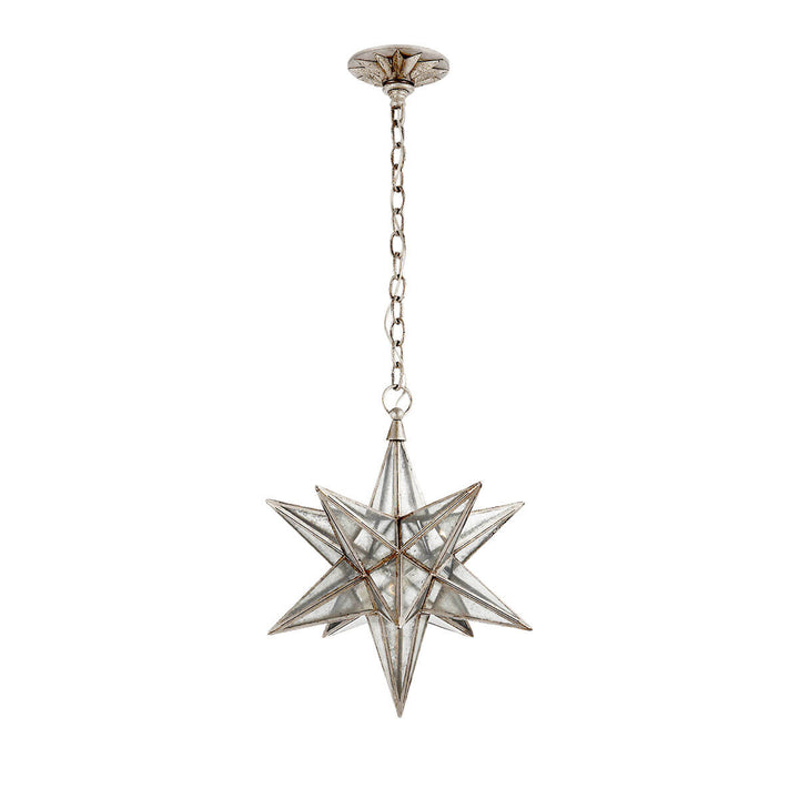 The medium sized Moravian Star Lantern is a star-shaped pendant light with burnished silver leaf joints, antique mirrored panels, and a delicate hanging chain.