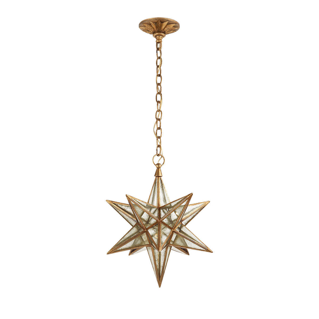 The medium sized Moravian Star Lantern is a star-shaped pendant light with gilded iron joints, antique mirrored panels, and a delicate hanging chain.