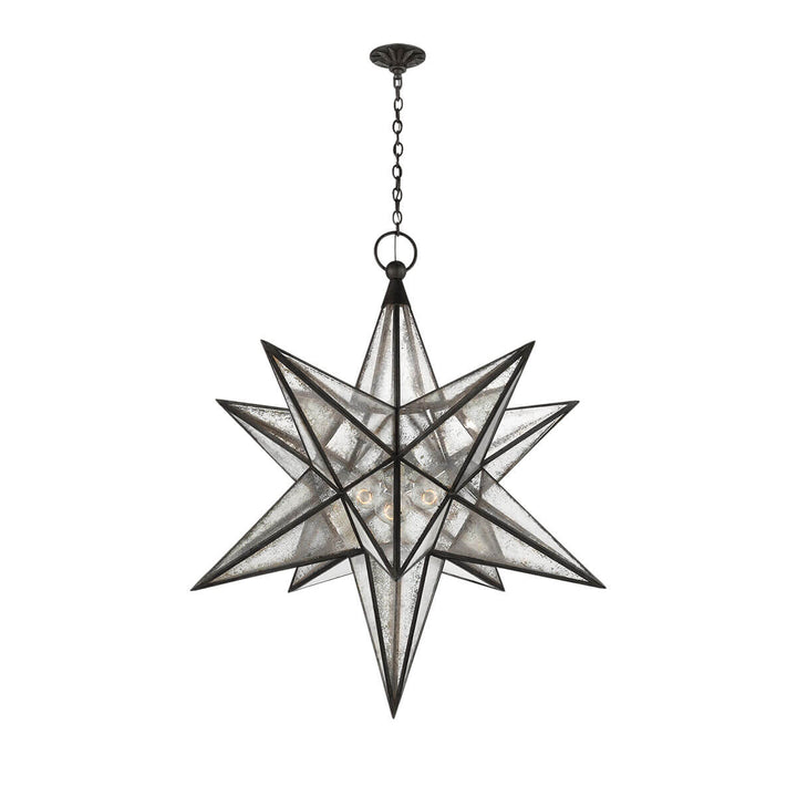 The extra-large Moravian Star Lantern is a star-shaped pendant light with aged iron joints, antique mirrored panels, and a delicate hanging chain.