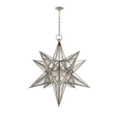 The extra-large Moravian Star Lantern is a star-shaped pendant light with burnished silver leaf joints, antique mirrored panels, and a delicate hanging chain.