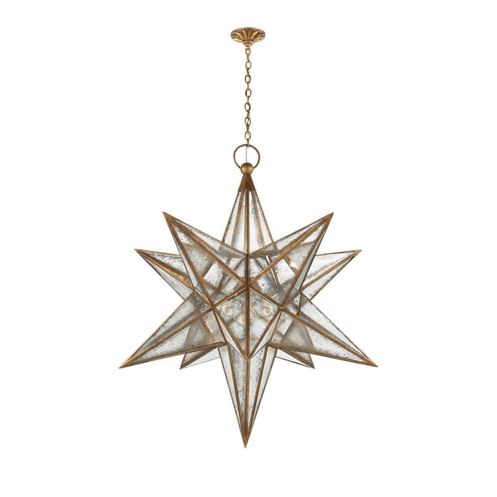 The extra-large Moravian Star Lantern is a star-shaped pendant light with gilded iron joints, antique mirrored panels, and a delicate hanging chain.