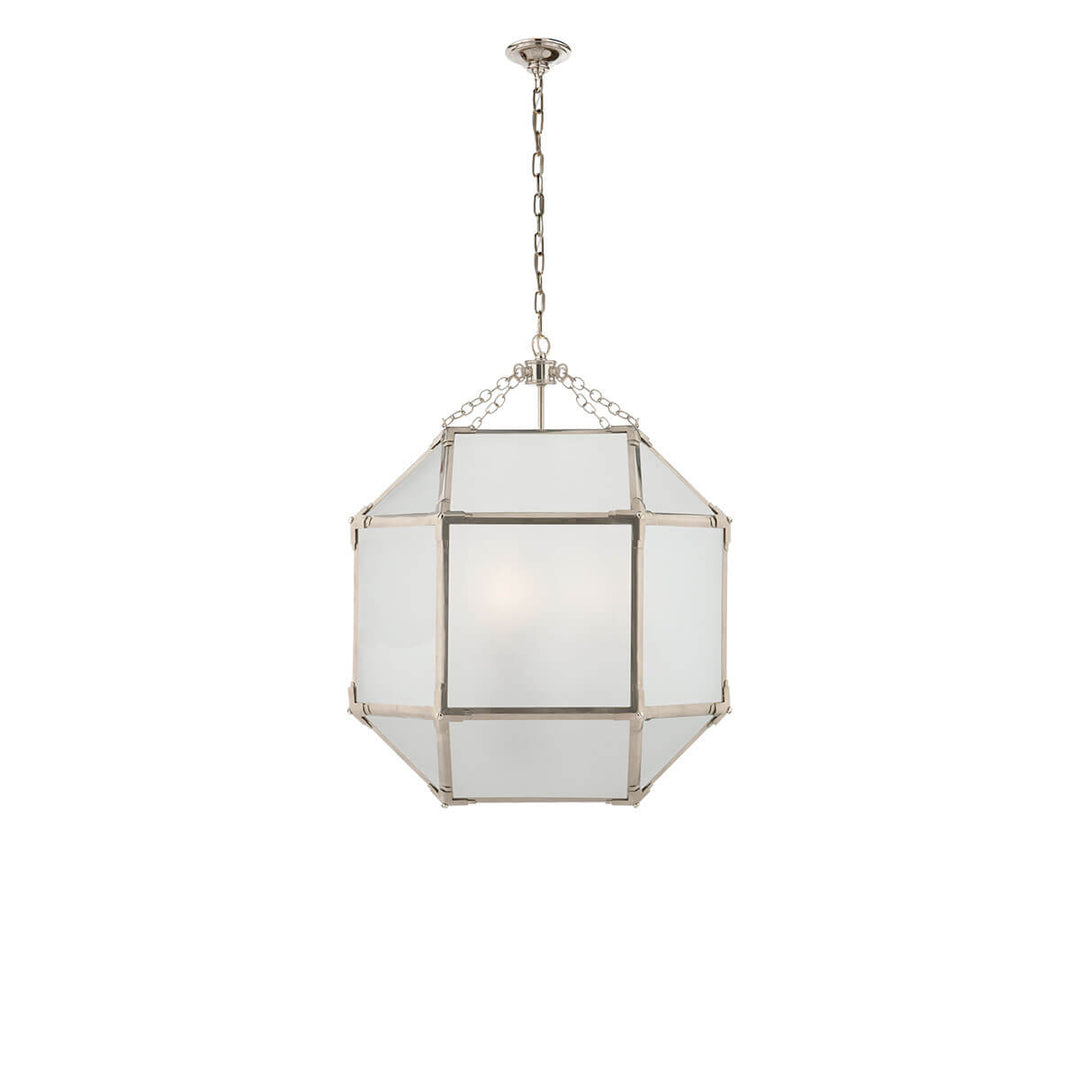 The Bruggen Medium Lantern has three candelabra lights in the middle of a polished nickel cage-like frame with visible joints and frosted glass panels.