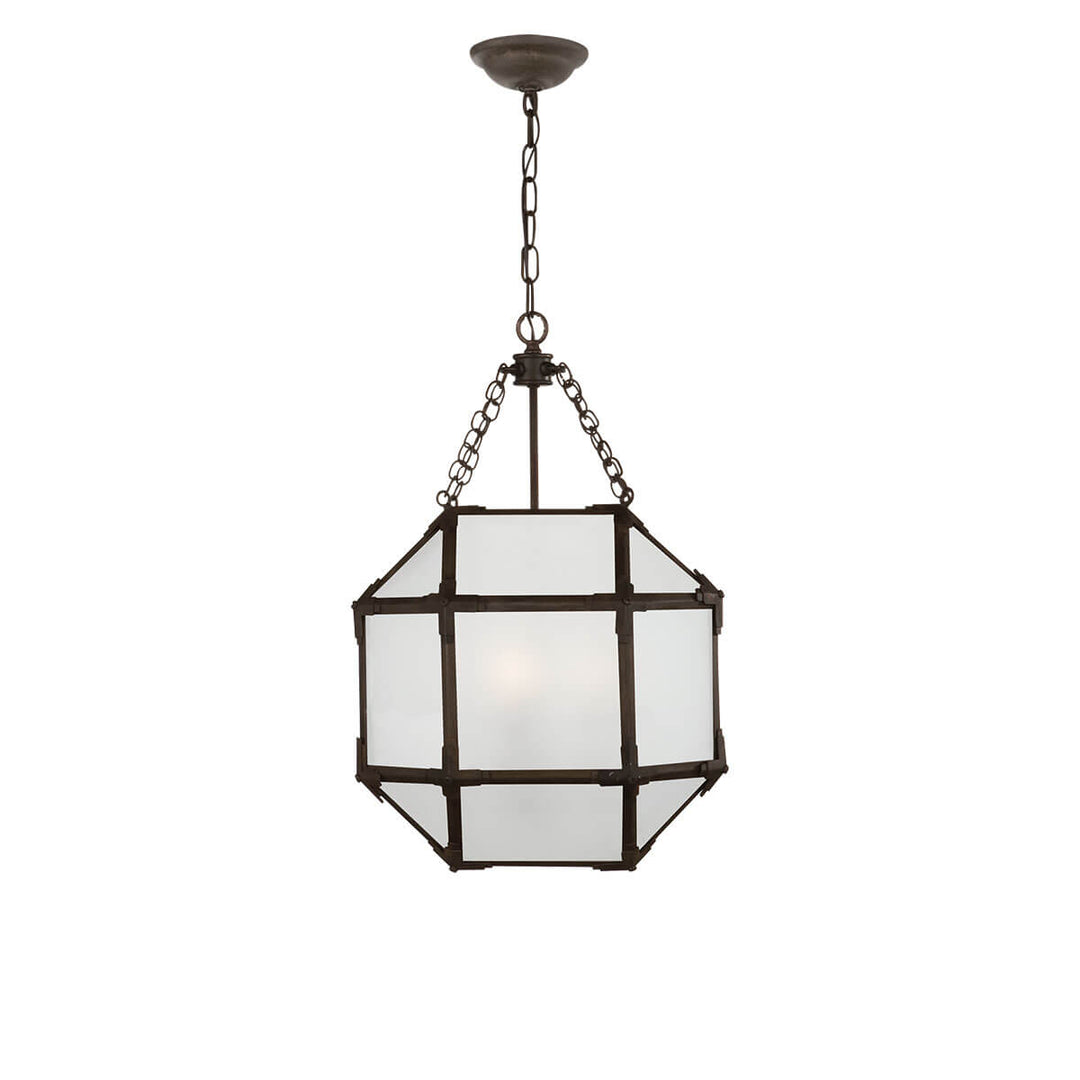 The Morris Lantern has three candelabra lights in the middle of an antique zinc, cage-like frame with visible joints and frosted glass panels.