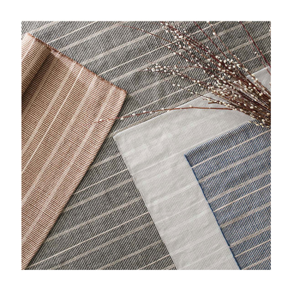 Grey Indoor and Outdoor Rug. Striped grey and white, blue, and black outdoor rugs made out of recycled plastic bottles.