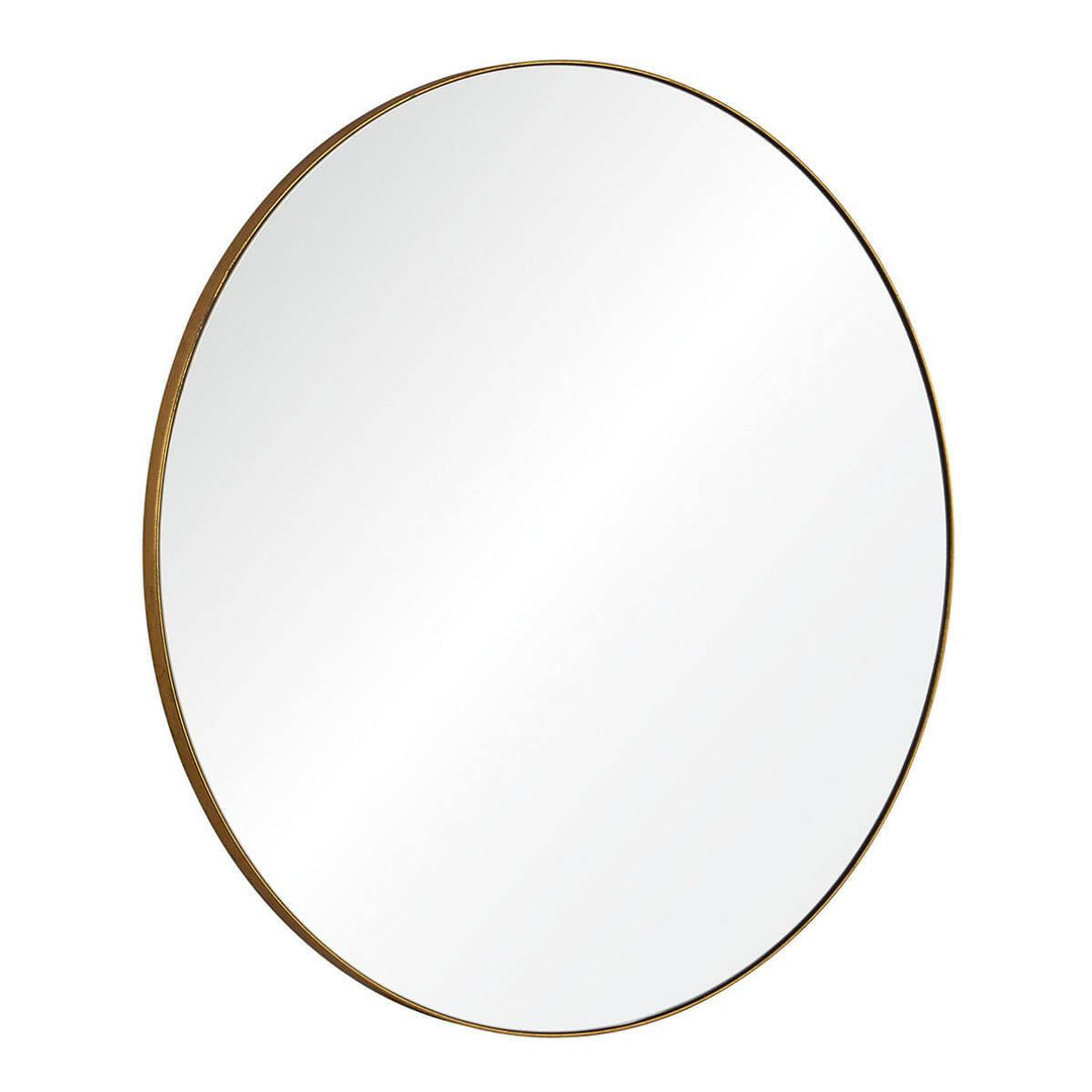 Modern, statement mirror with a round, gold frame.