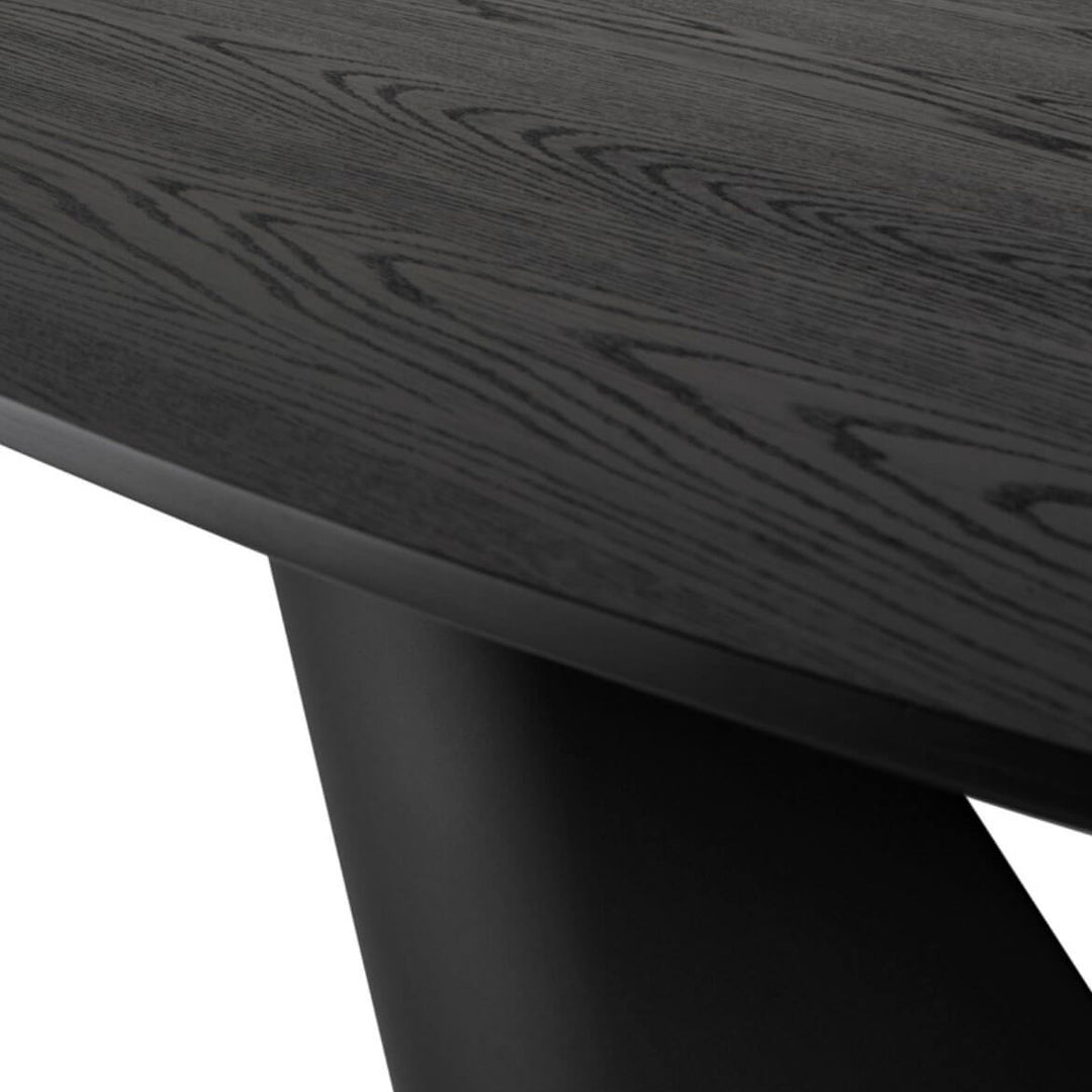 Wood grain and black finish details on the contemporary round dining table.