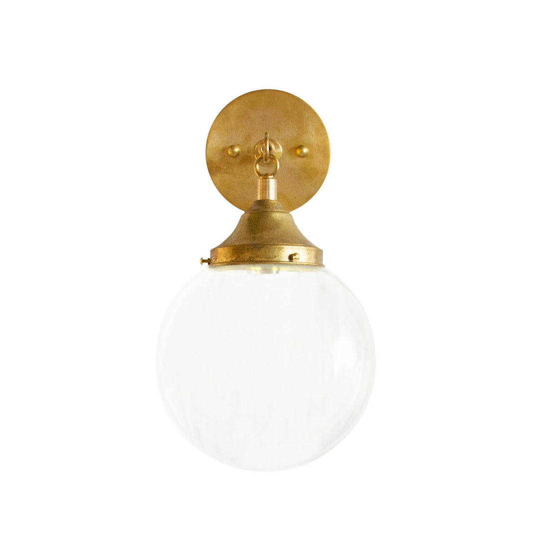 Hand Rubbed Antique brass hardware with orb globe light and clear glass. Meant for a bathroom or hallway.