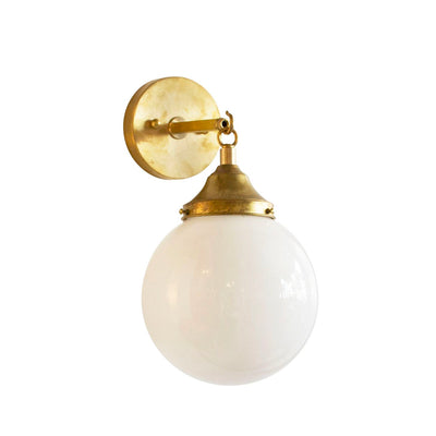 Hand Rubbed Antique brass hardware with orb globe light and opal glass. Meant for a bathroom or hallway.