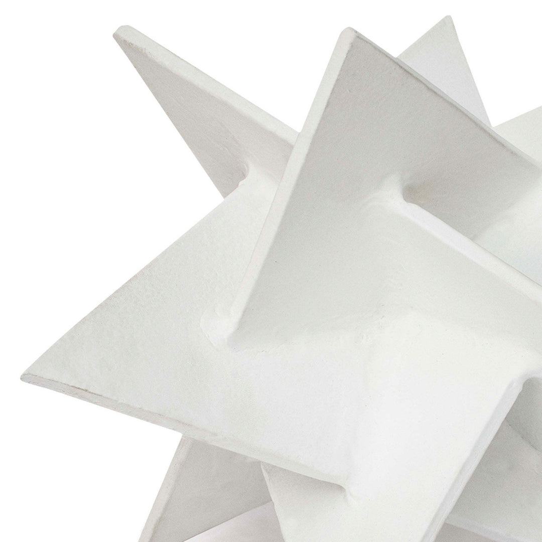 Close up of abstract origami star aluminum sculpture.