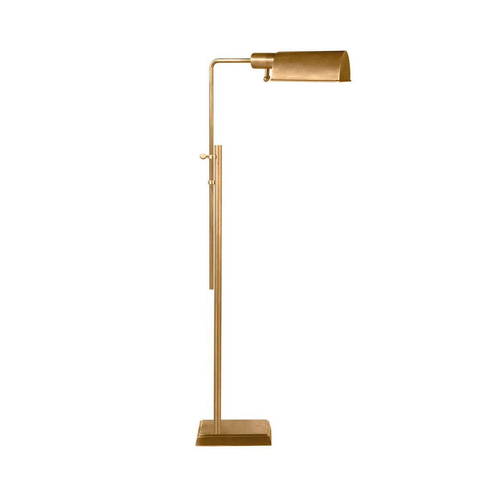 The Pask Pharmacy Floor Lamp has dome-like metal shade in a hand-rubbed antique brass finish and has adjustable height and a pharmacy lamp look.