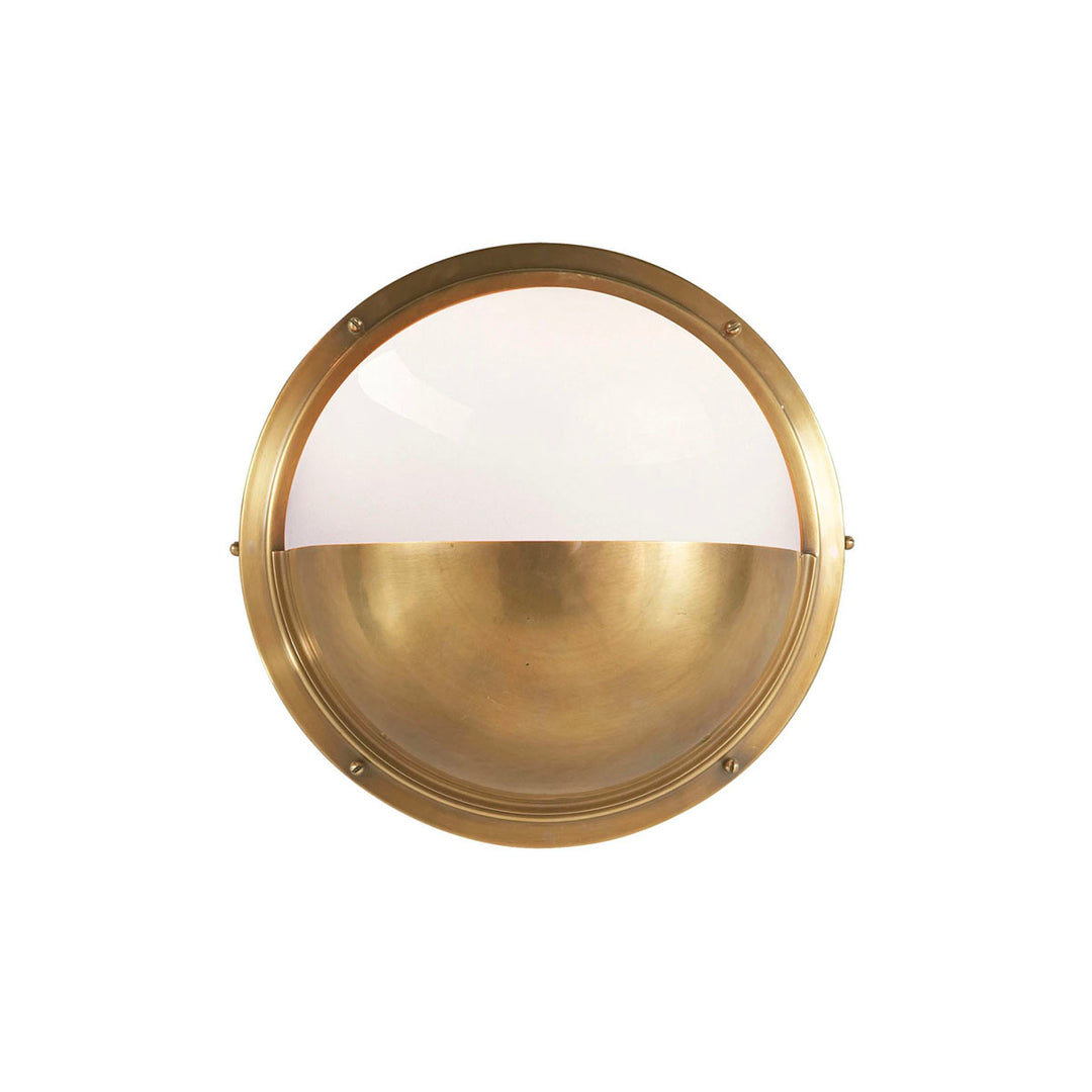 The Pelham Moon Light is a half sphere globe combining antique brass with white glass.
