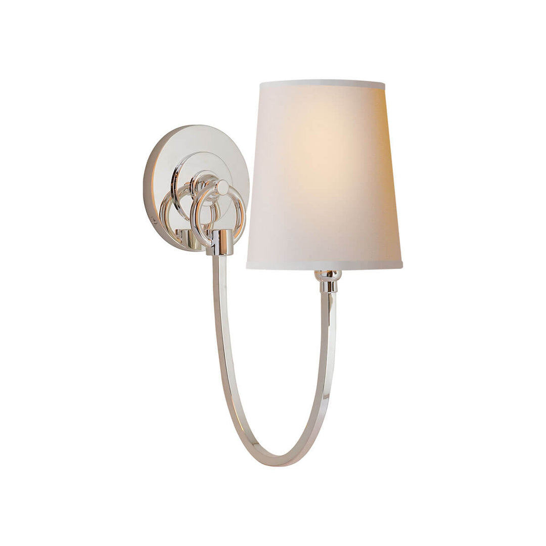 The Reed Wall Sconce has a natural paper shade and a polished nickel hooked arm and round backplate.