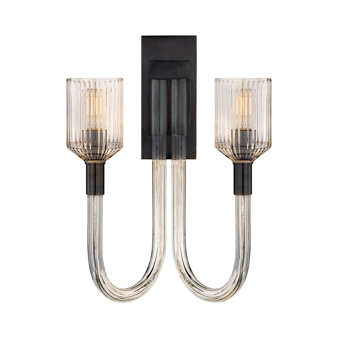 The Reverie Double Wall Sconce is finished in a dark bronze with clear ribbed glass for a traditional vintage charm.