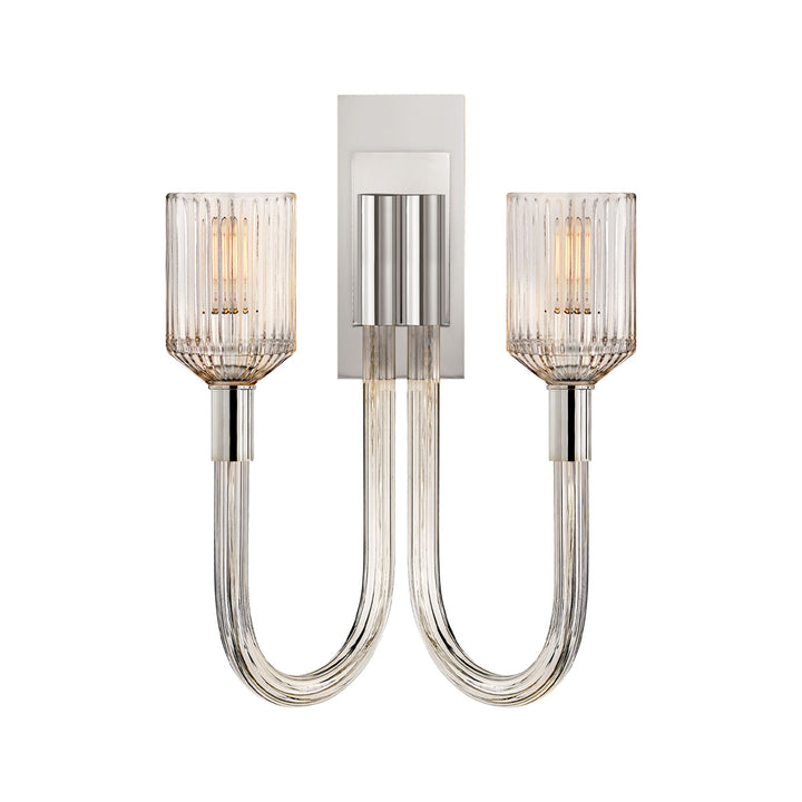 The Reverie Double Wall Sconce is finished in bright polished nickel with clear ribbed glass for a traditional vintage charm.