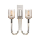 The Reverie Double Wall Sconce is finished in bright polished nickel with clear ribbed glass for a traditional vintage charm.