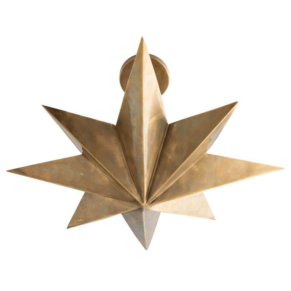 Tarragona Pendant. Star shaped statement pendant in an warm antique brass finish and four lights that reflect upward.