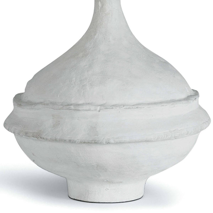 Matte white paper mache base with texture on the carved, bohemian table lamp.