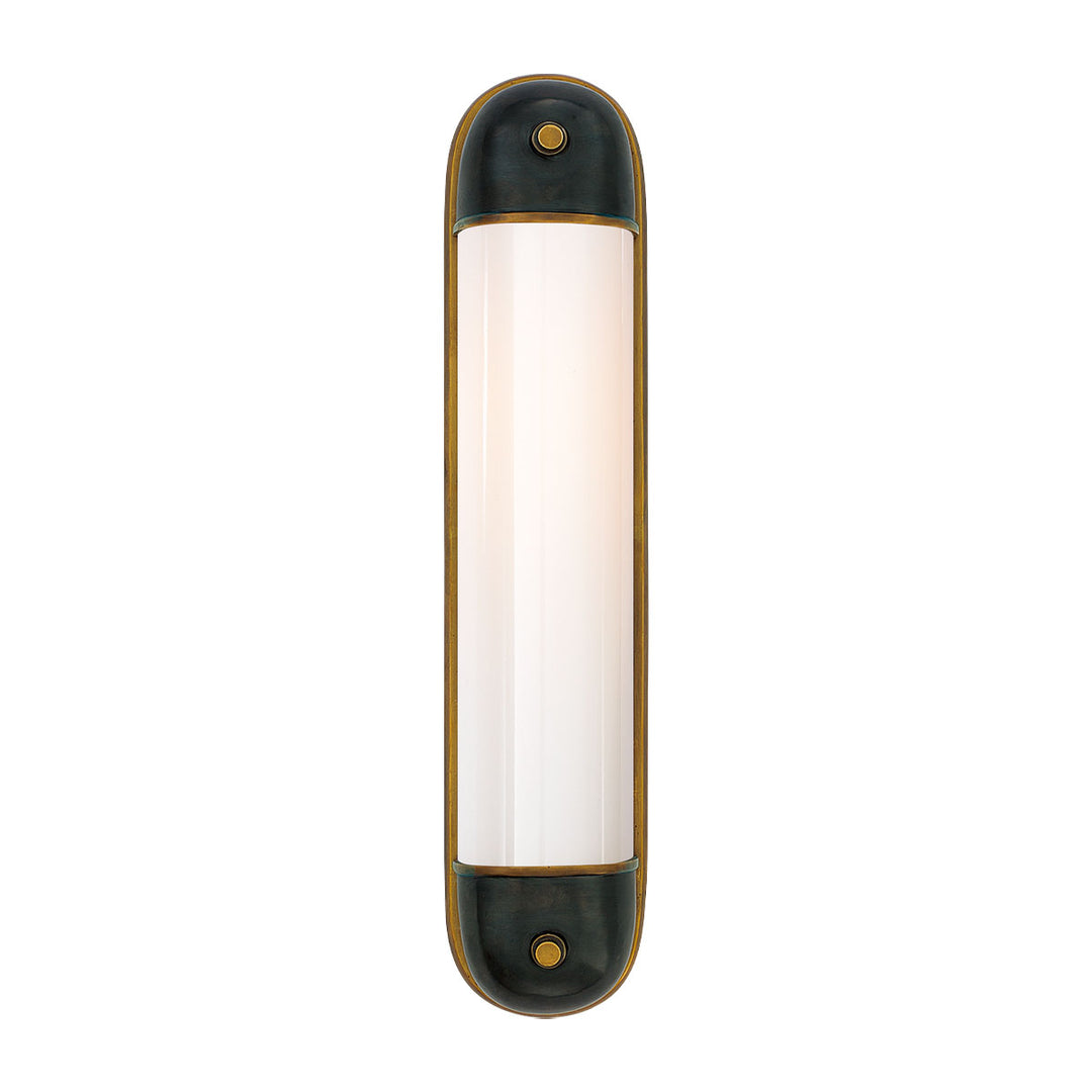 The Selecta Wall Sconce features a combination of bronze and antique hand rubbed brass metals. The pill shaped silhouette is perfect for flanking the sides of a mirror or bed.
