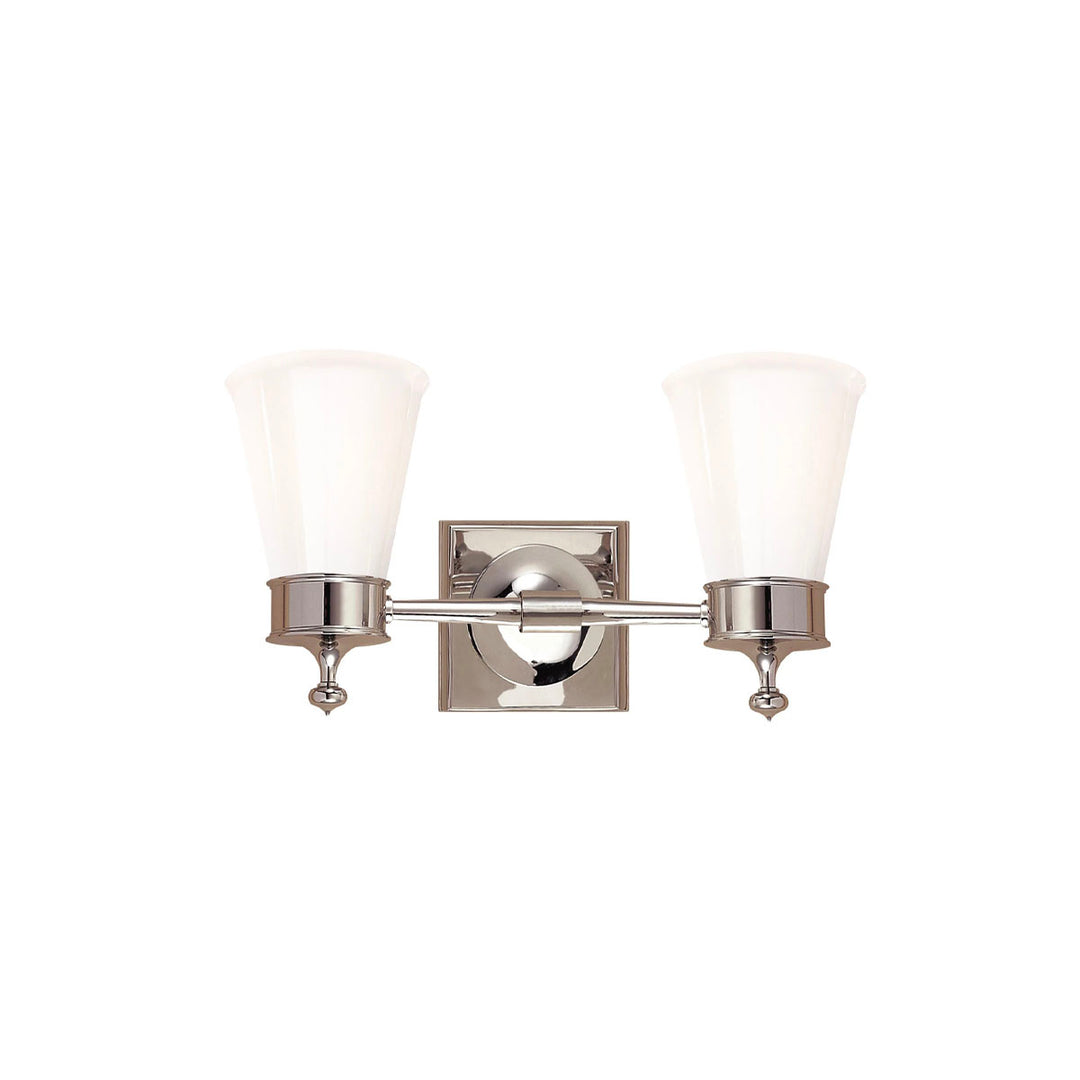Double Sconce in Polished Nickel combines classic details like finials with a white glass shade. To accent a bathroom vanity.