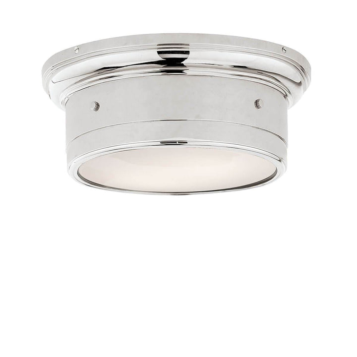 The Siena Flush Mount has a simple drum shape in a chrome finish with covered bolt details and a white glass diffuser.
