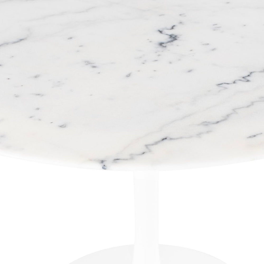 Marble detail on round dining table. Mid-century design in dining room. White aluminum base.