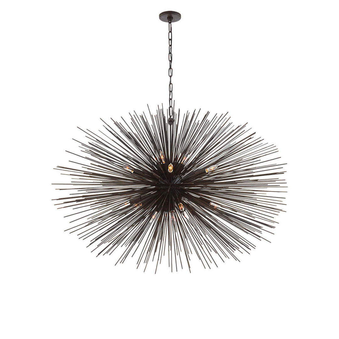 The Strada Oval Chandelier has twenty small lights hidden within the aged iron metal spike arms on the starburst pendant.