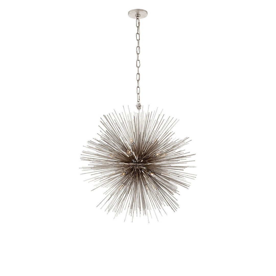 The Strada Round Chandelier has twenty small lights hidden within the burnished silver leaf metal spike arms on the round starburst pendant.
