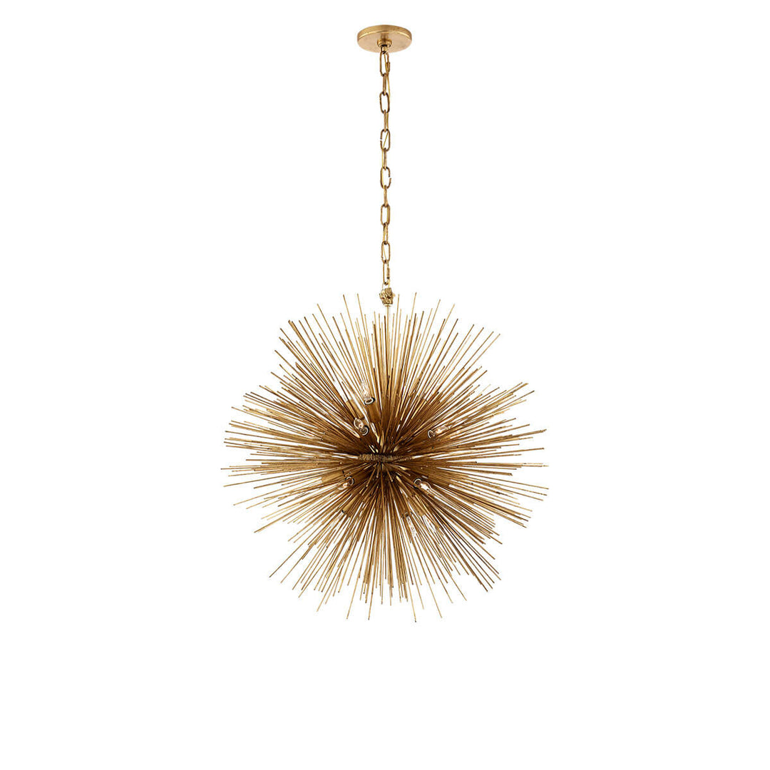The Strada Round Chandelier has twenty small lights hidden within the gild metal spike arms on the round starburst pendant.