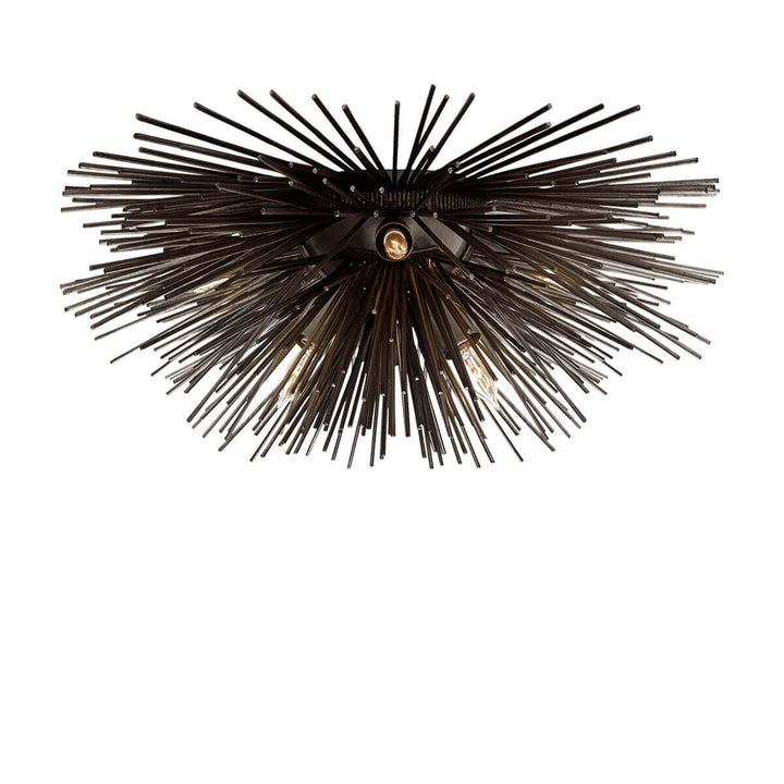 The Strada Flush Mount has twelve small lights amongst an aged iron starburst with metal spikes.