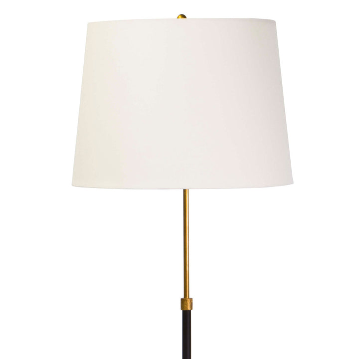 Close up of the Summerside Floor Lamp with a structured natural linen shade and a sleek gold and black base.