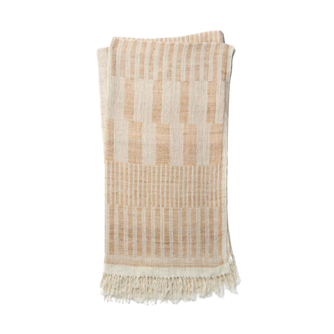 The Tejada Throw - Ivory / Beige is a luxurious, wool and silk blend throw blanket with an ivory and beige ancient tribal pattern.