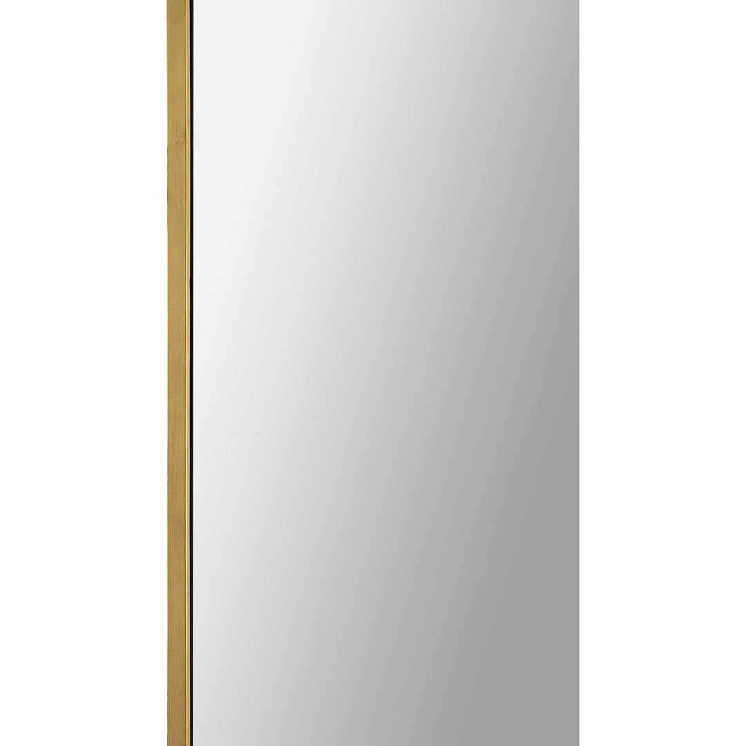 Thin gold leaf frame on the minimal full-length mirror.