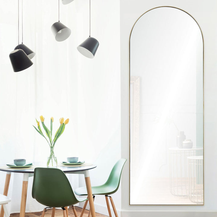 Glam arched frame in a modern dining room.