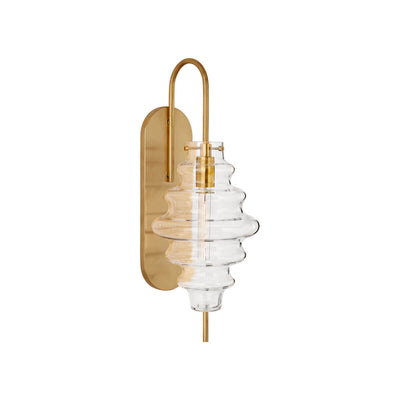 The Tableau Wall Sconce has an antique burnished brass backplate and hooked arm with a clear glass rippled lamp shade.