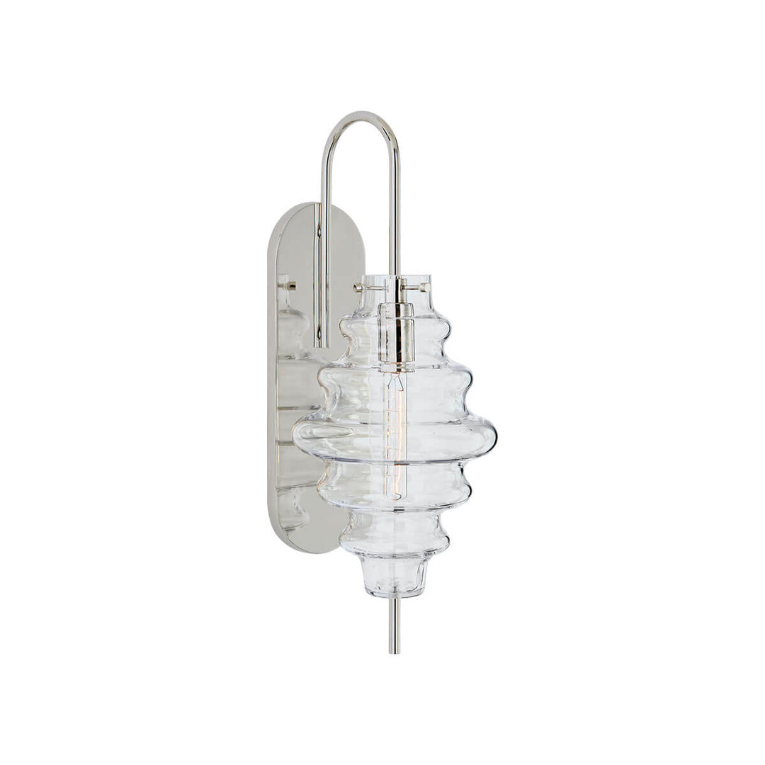 The Tableau Wall Sconce has a polished nickel backplate and hooked arm with a clear glass rippled lamp shade.