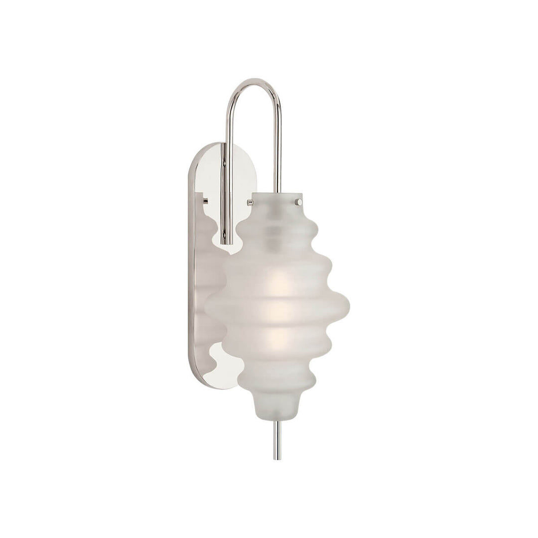 The Tableau Wall Sconce has a polished nickel backplate and hooked arm with a volcanic glass rippled lamp shade.