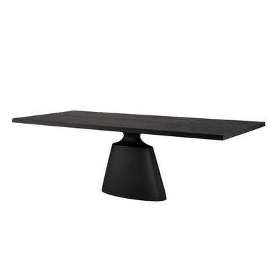 Modern dining table with a sleek, architectural shape and dark onyx finish.