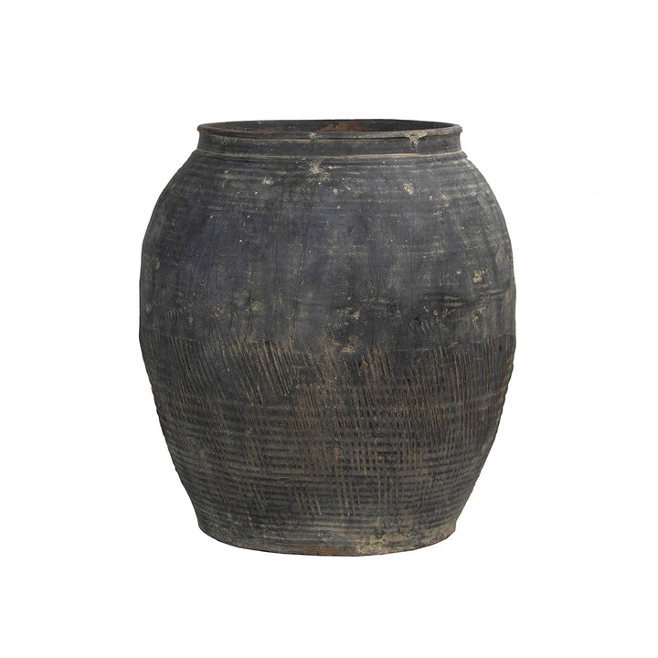 Antique large water pot from China with rustic textural details.