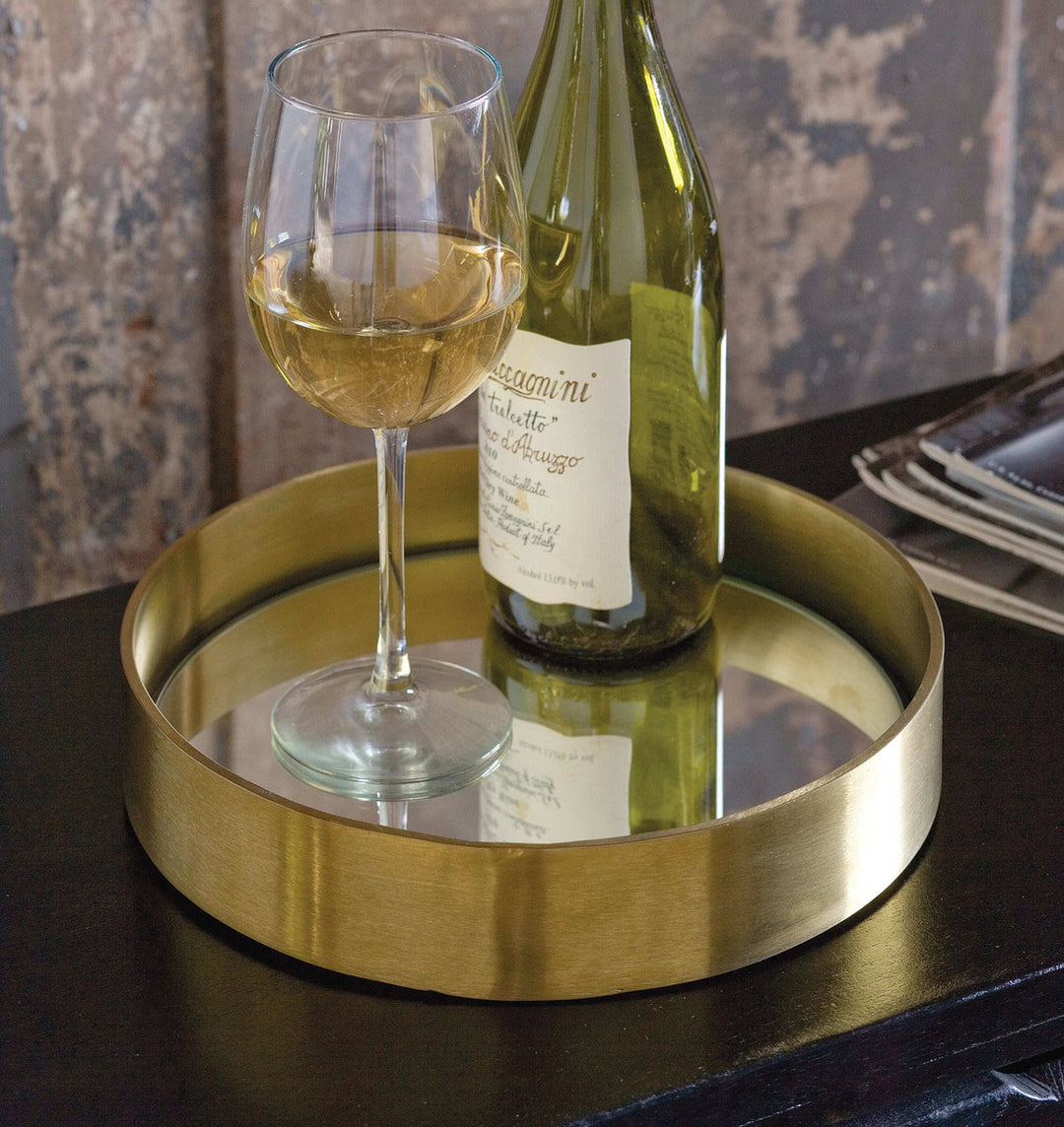Glam serving tray holding a wine bottle and glass.
